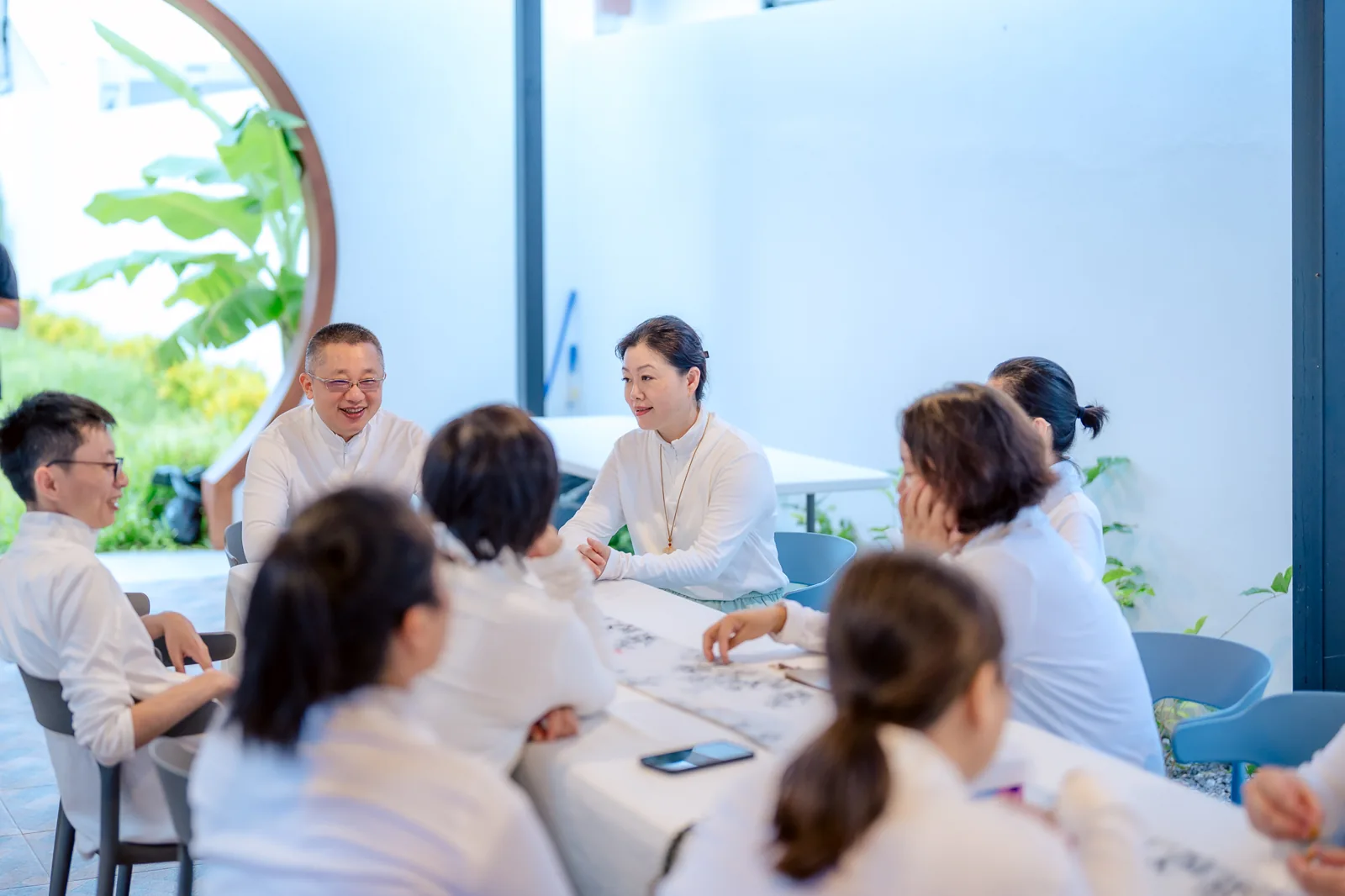 Participants sharing conversation at Rebirth-X
